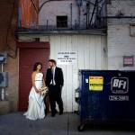 Calgary Wedding Photographer | Bride and Groom in Back alley of Stephen Ave beside dumpster