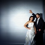 Calgary Wedding Photographer | Bride and Groom in Alley against roll up garage door