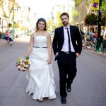 Calgary Wedding Photographer | Bride and Groom Walking down Stephen Ave