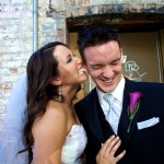 Calgary Wedding Photographer | Bride biting grooms ear