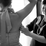 Calgary wedding photographer | Drumheller Wedding | bridesmaid getting deodorant put on by mother