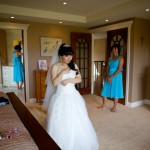 Calgary wedding photographer | Drumheller Wedding | Bride getting ready with bridesmaids in background