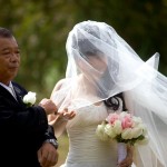 Calgary wedding photographer | Drumheller Wedding | Farm yard | Bride with father wind blowing veil