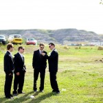 Calgary wedding photographer | Drumheller Wedding | Farm yard | Groom and groomsmen hanging out